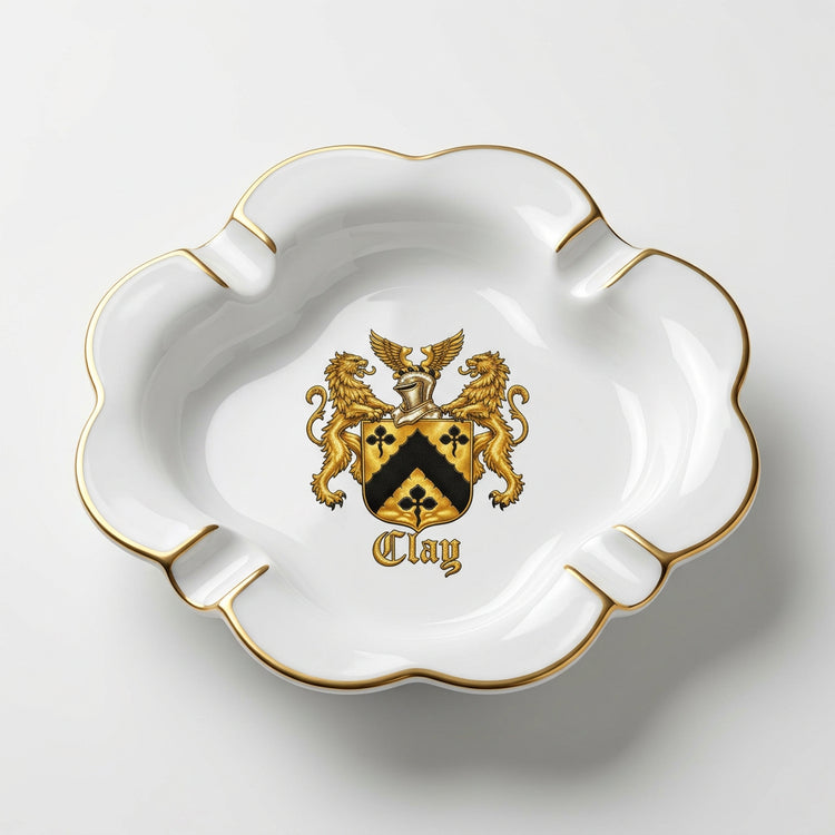 White porcelain clover ashtray with centered Lion’s Crest and gold rim