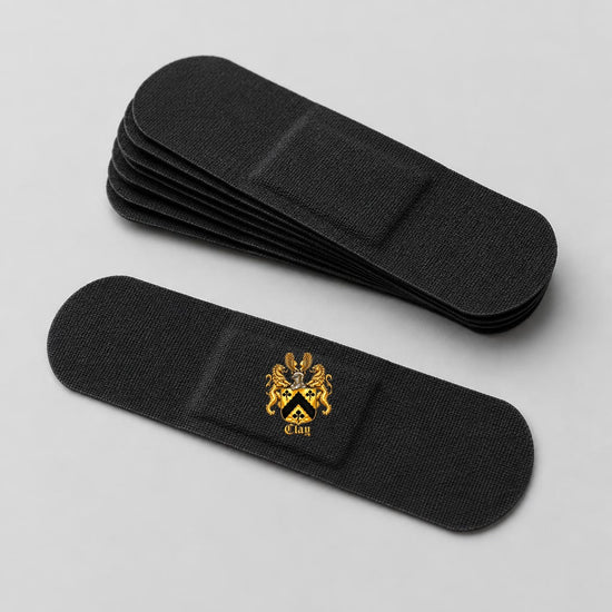 Black adhesive bandages with the gold Clay crest