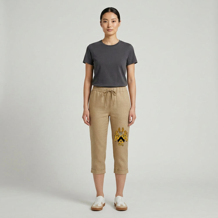 Fitted mid-calf linen capris with elastic drawstring waist and official crest