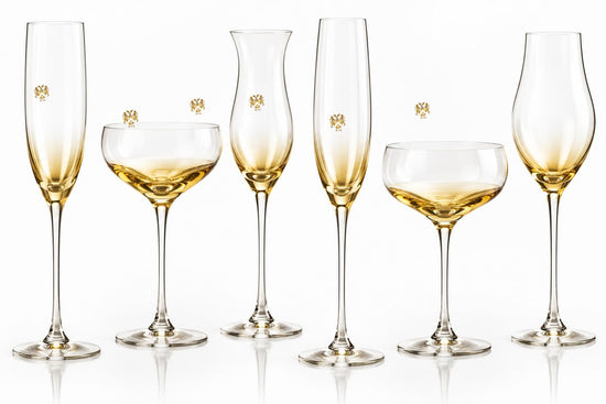 Crystal champagne glasses with gold-to-clear fade and centered official Lion&