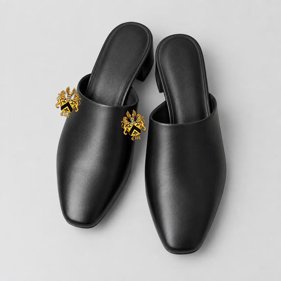 Top view of black leather mules with two-inch official Lion&