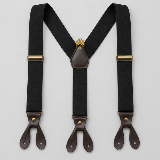 Black adjustable Y-back suspenders with brass hardware, leather button tabs, and the official full Lion’s Crest