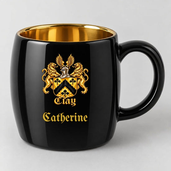 Black oval mug with gold interior, the gold lion crest, and the name Catherine in gold Old English script