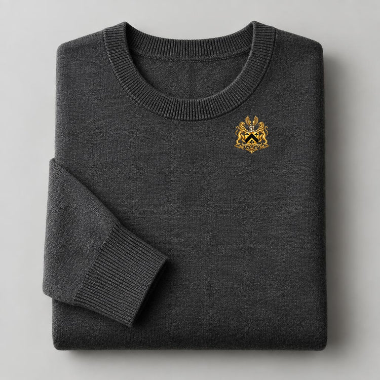 Charcoal merino wool crew-neck sweater with small gold crest